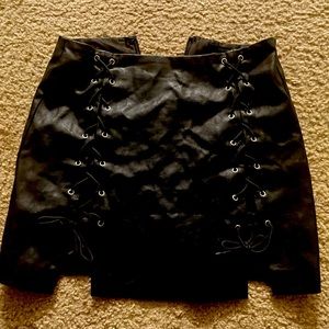 Mini laced black faux leather skirt